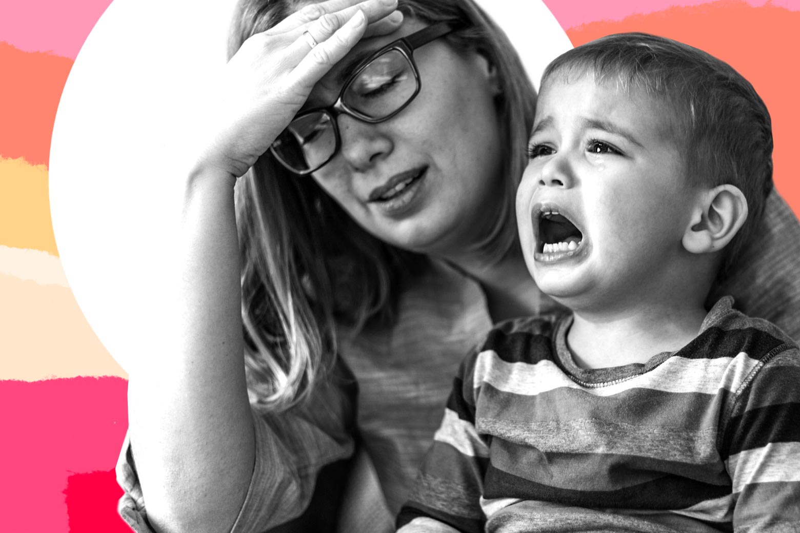 A tired woman, wearing glasses, puts her hand to her head as her kid cries.