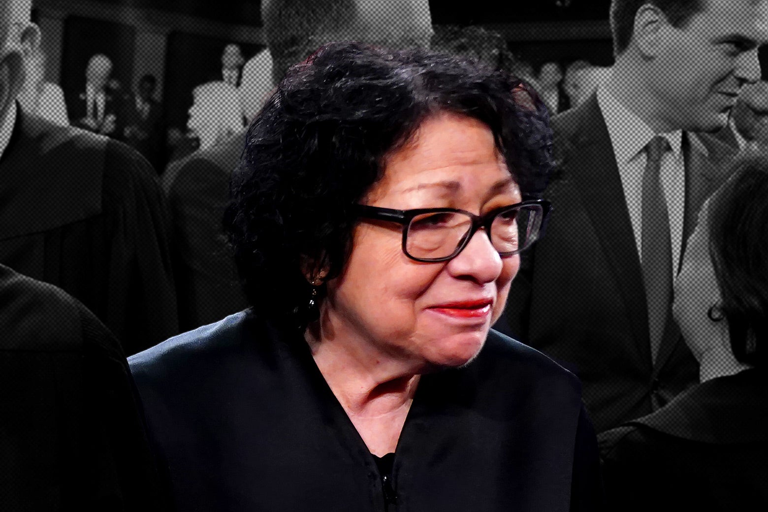 Sonia Sotomayor smiles looking off to the side; behind her in black and white is a crowded room.