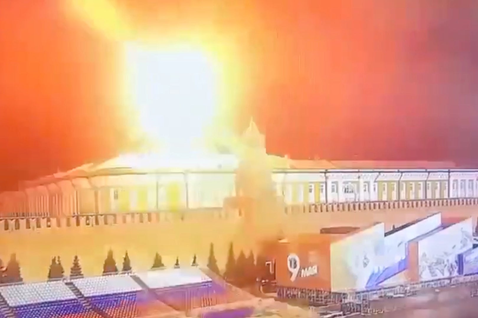 A bright orange burst of light above the Kremlin.