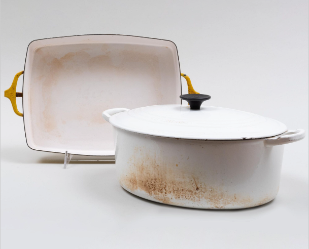 Two well-used porcelain bakeware dishes.