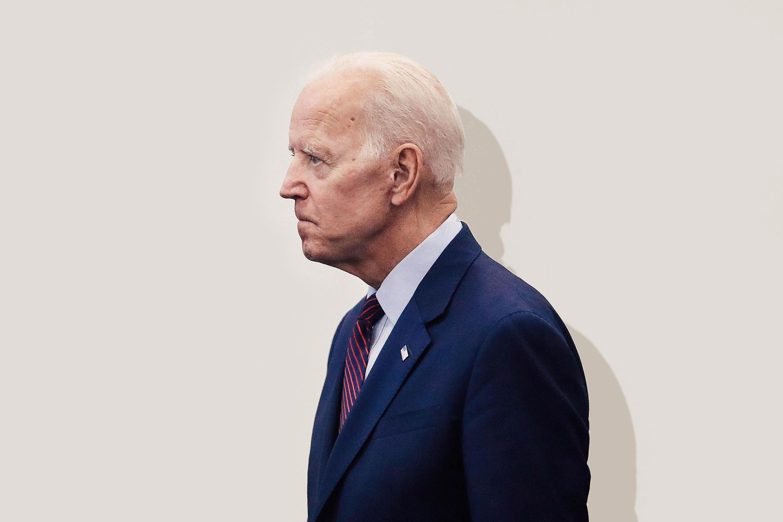 Joe Biden in profile, looking stern.