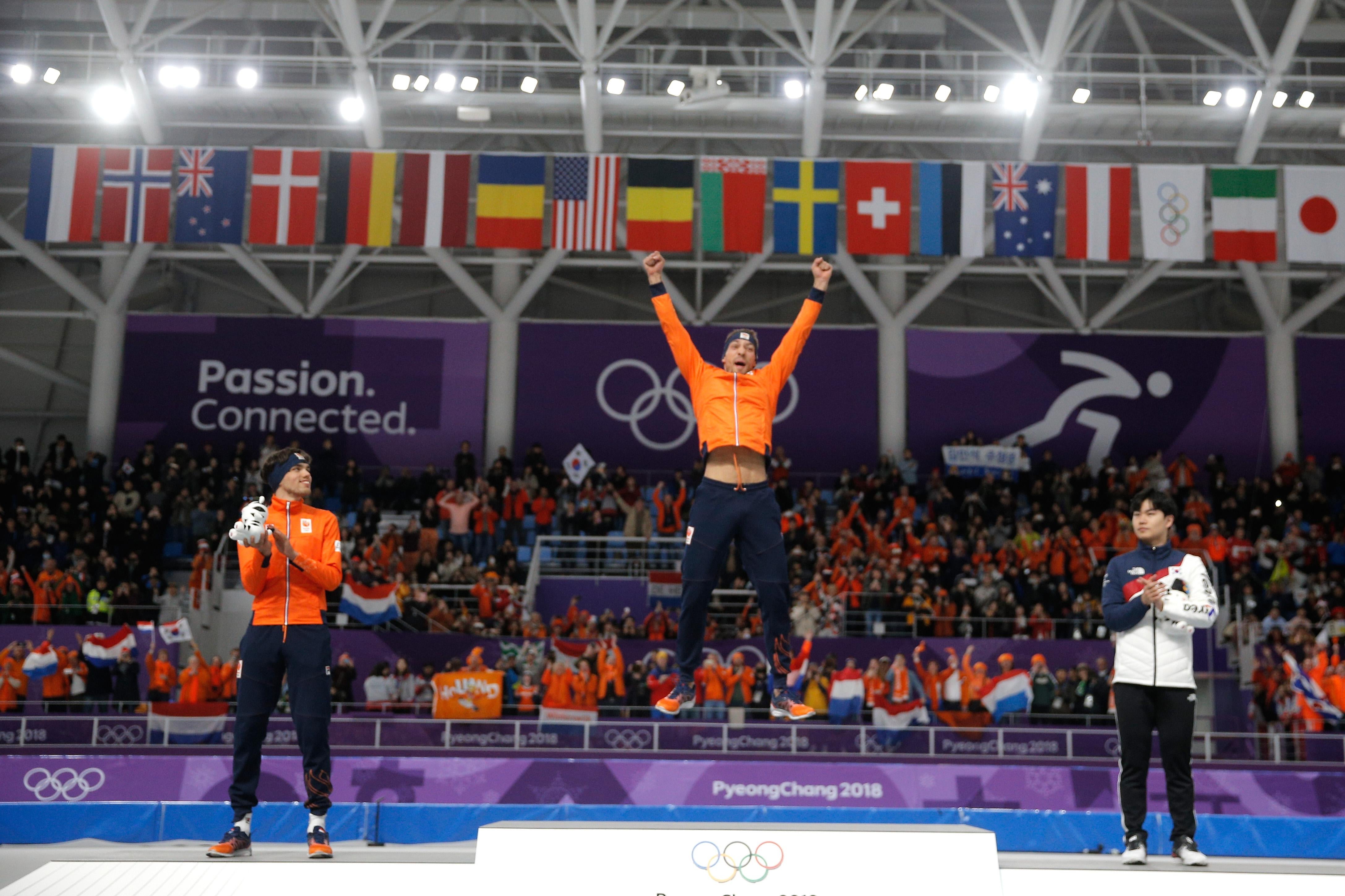 GANGNEUNG, SOUTH KOREA - FEBRUARY 13:  Gold medalist Kjeld Nuis of the Netherlands (C) celebrates with silver medalist Patrick Roest of the Netherlands (L) and bronze medalist Min Seok Kim of Korea (R) during the victory ceremony after the Men's 1500m Speed Skating on day four of the PyeongChang 2018 Winter Olympic Games at Gangneung Oval  on February 13, 2018 in Gangneung, South Korea.  (Photo by Dean Mouhtaropoulos/Getty Images)