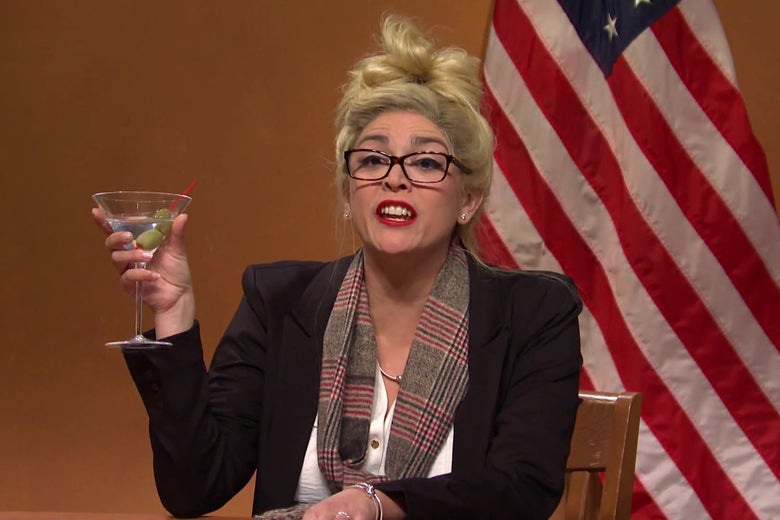 Cecily Strong, dressed as Melissa Carone, holding a martini, in a still from SNL.