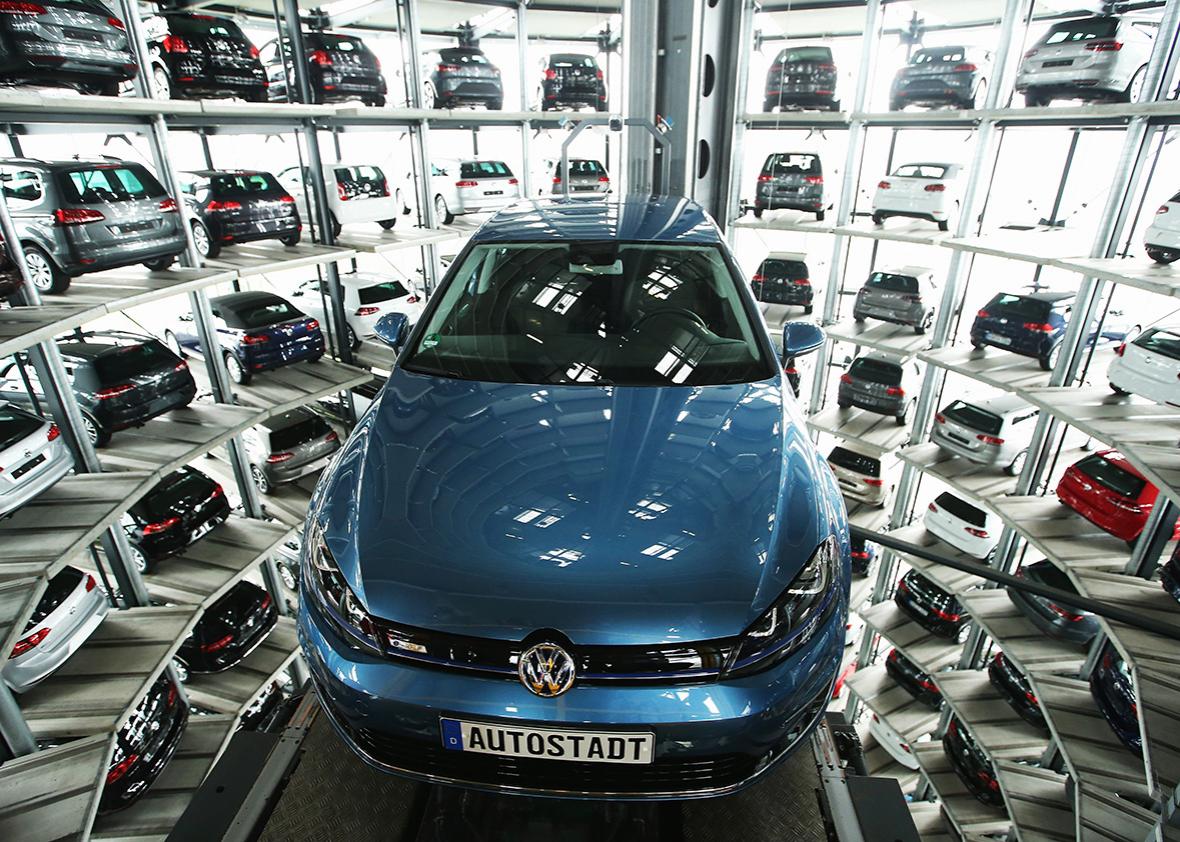 New passenger cars of German automaker Volkswagen AG await their new owners in one of the twin car towers at the Volkswagen factory on day of the company's annual press conference on April 28, 2016 in Wolfsburg, Germany. 