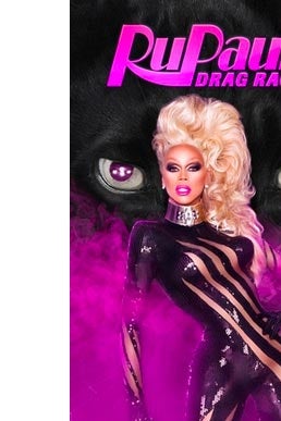 RuPaul wears a fluffy blonde wig and stands in a purple mist. In the background, two purple, beastlike eyes.