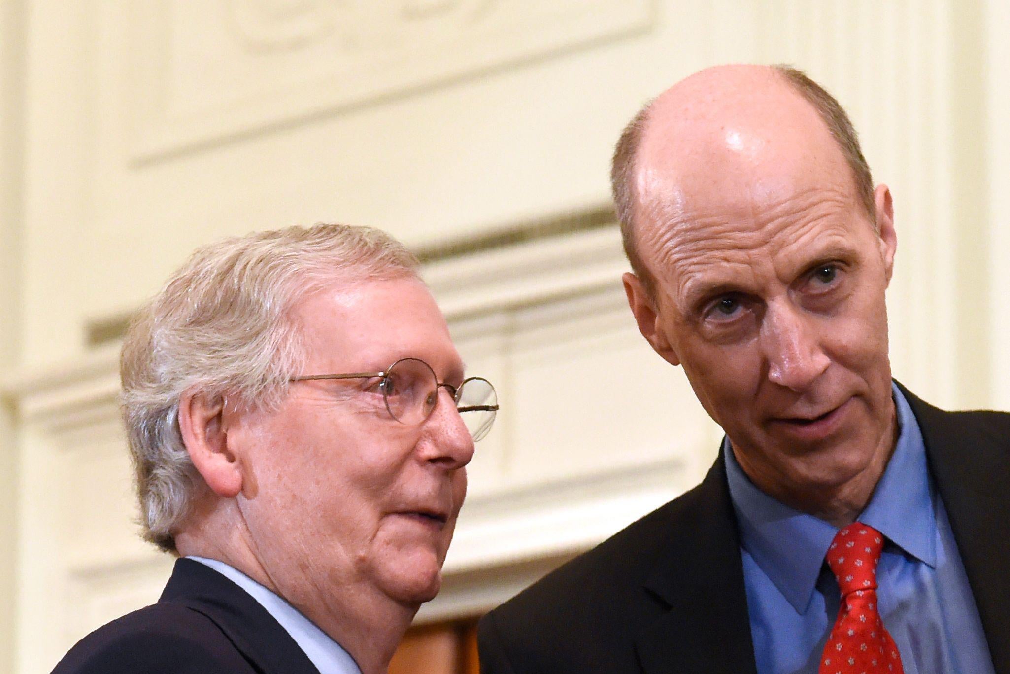 Mitch McConnell talks with Ed Whelan at the White House.