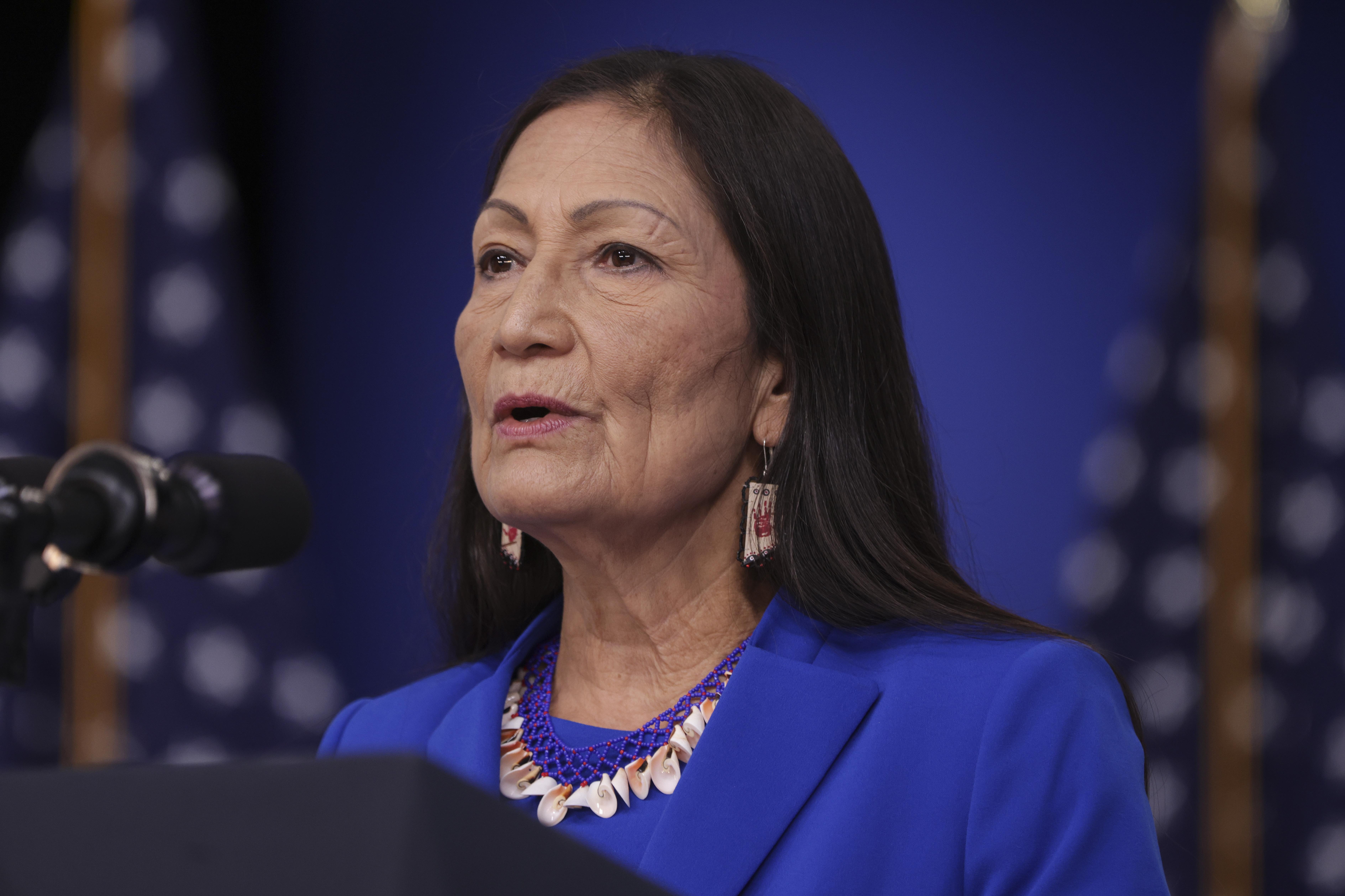 Deb Haaland speaking at a podium.