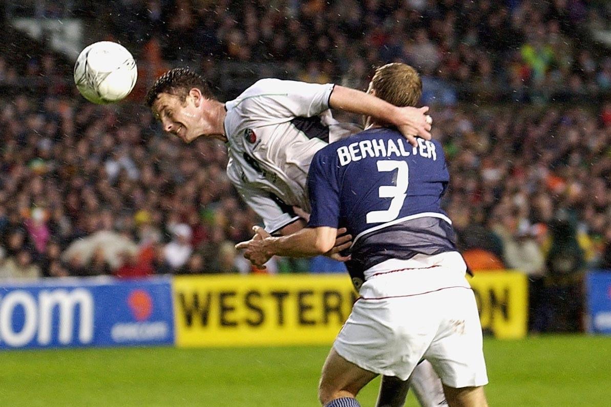 Mark Kinsella of Ireland is challenged by Gregg Berhalter of the USA.