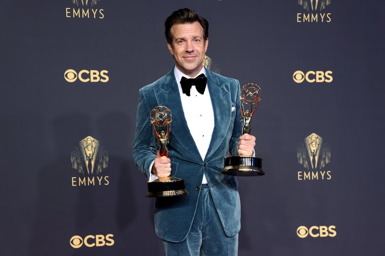 Jason Sudeikis holds two of Ted Lasso's Emmys.