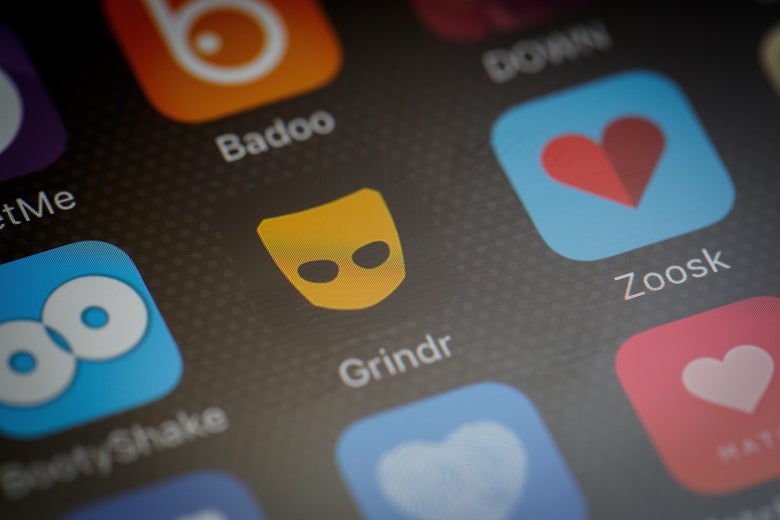 The 'Grindr' app logo is seen amongst other dating apps on a mobile phone screen.