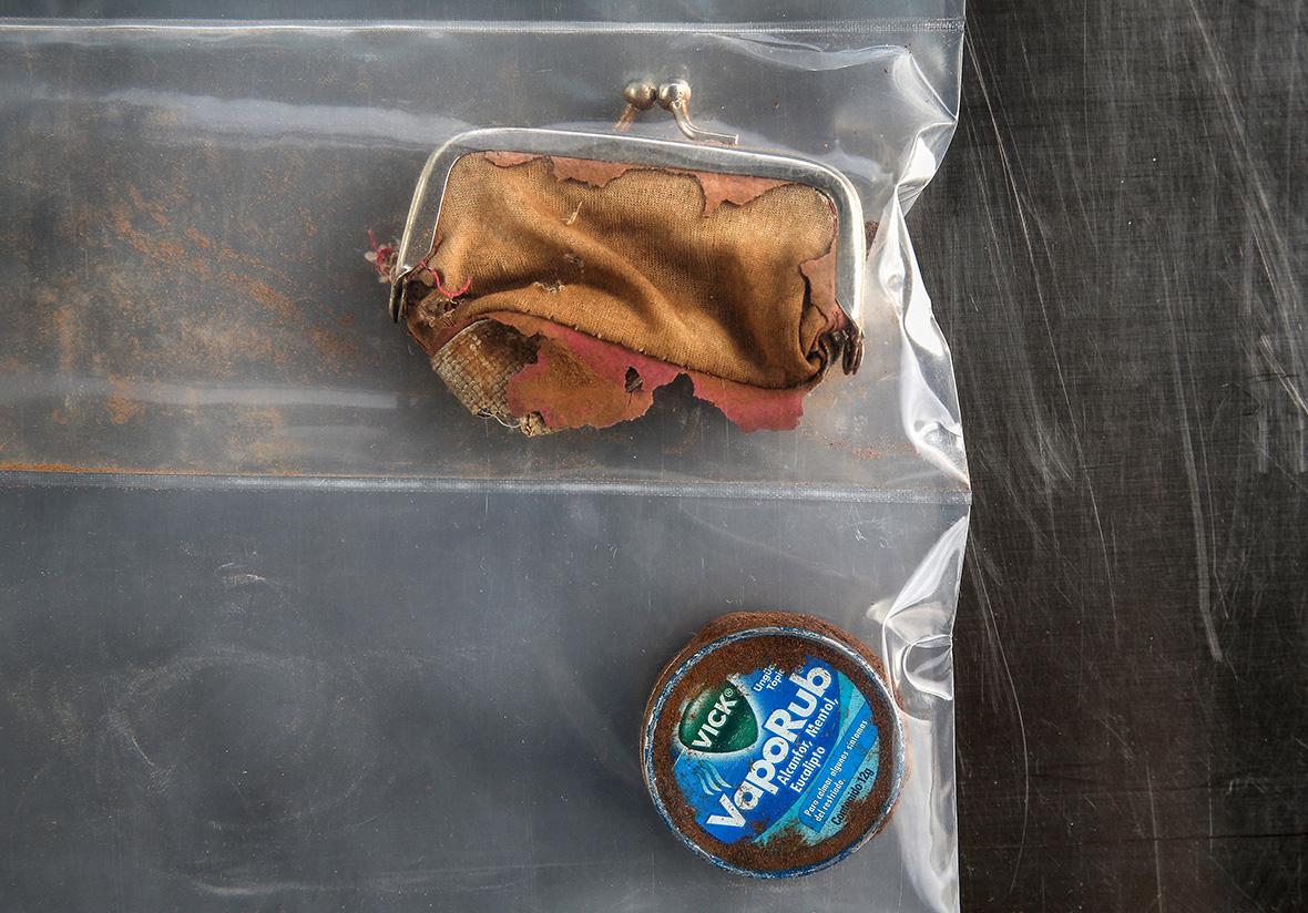 A change purse and a Vic's Vapor Rub container found with the skeletal remains of a person discovered in the Arizona desert on Sept. 23, 2014. 