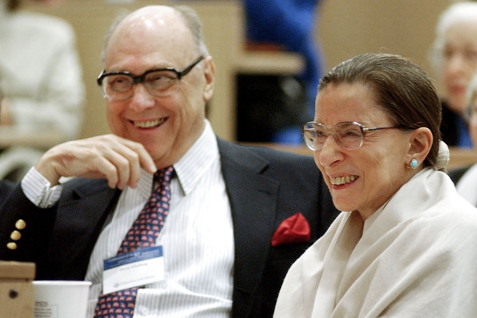 Ruth Bader Ginsburg and her husband laughing.