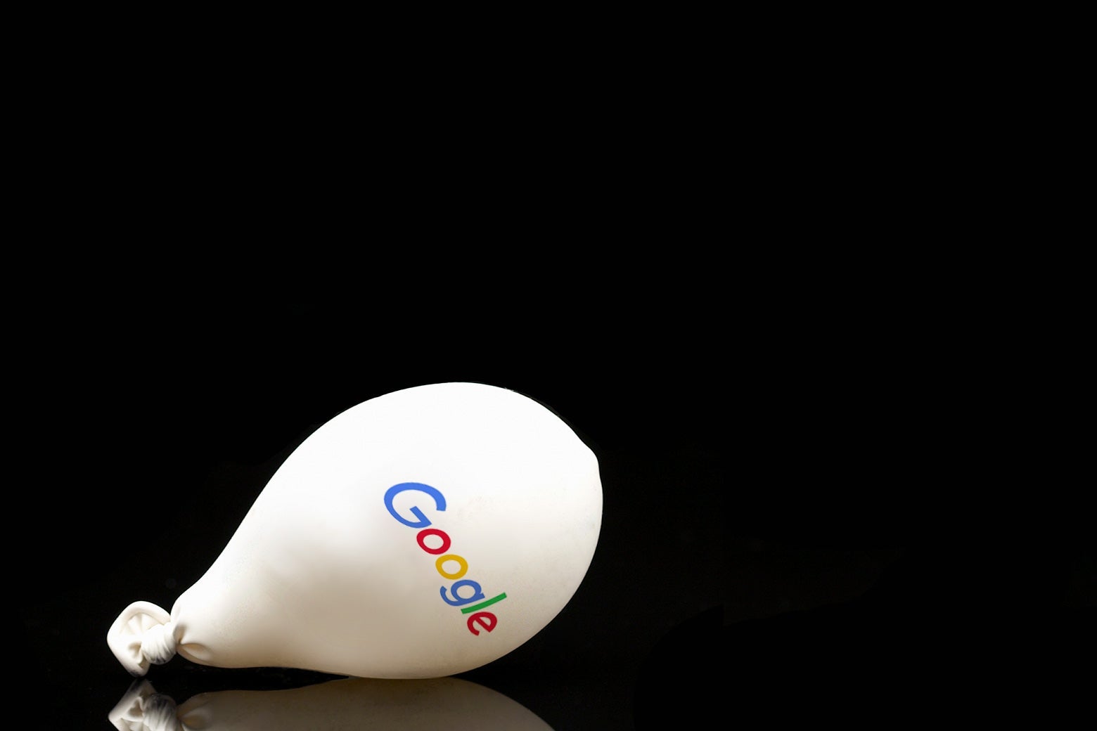 A deflating balloon with the Google logo on it