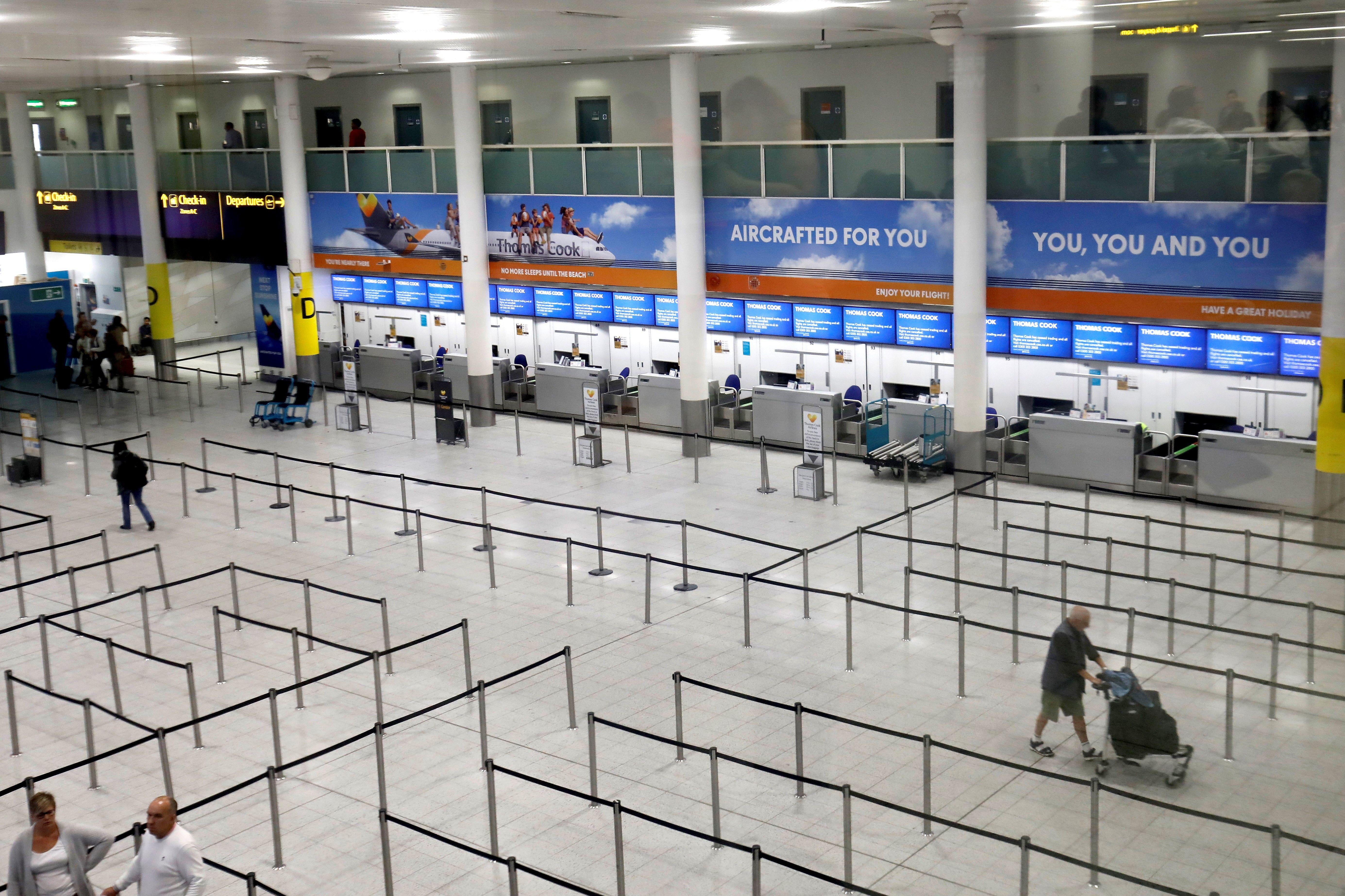 Closed Thomas Cook check-in desks at Gatwick Airport.