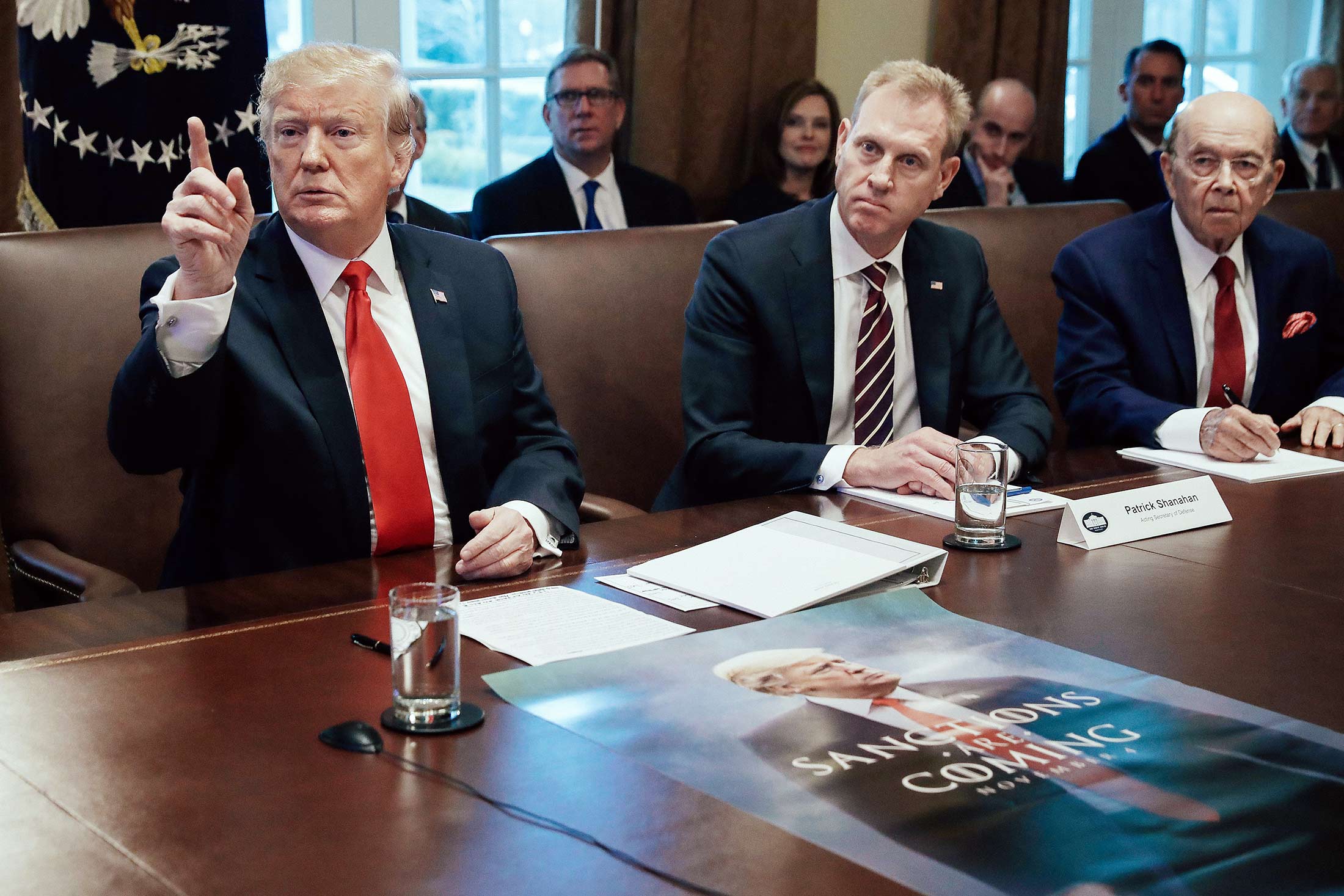 Donald Trump, Patrick Shanahan, and Wilbur Ross at a table in the White House.