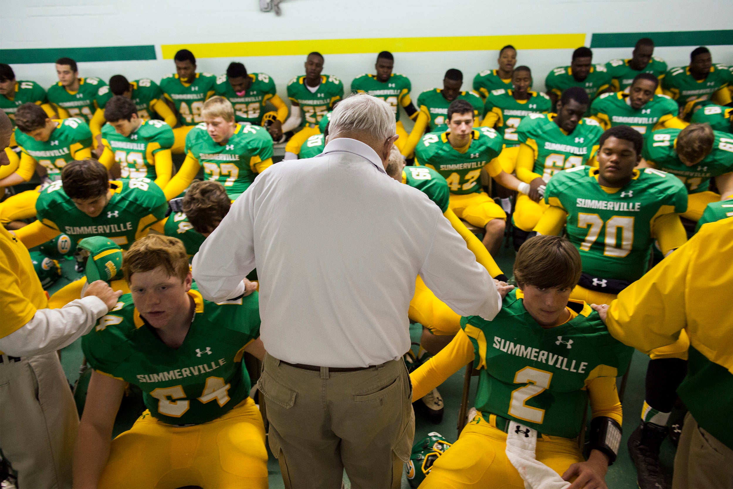 Summerville High School's head football coach John McKissick leads the team in a prayer in Summerville, South Carolina.
