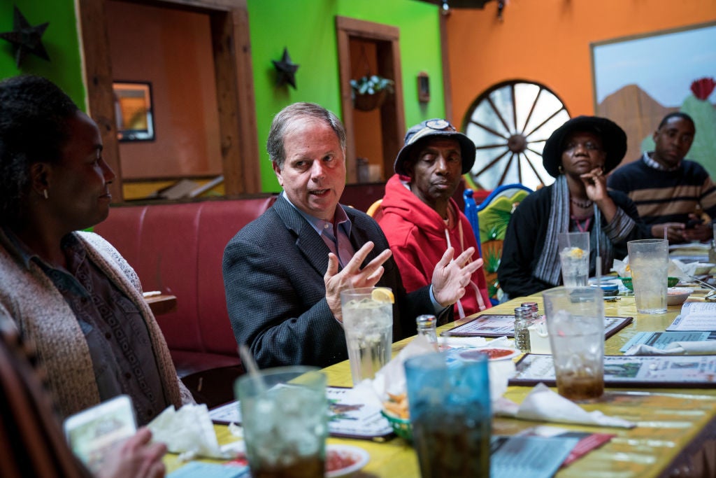 Doug Jones at a restaurant in Talladega, Alabama with voters.