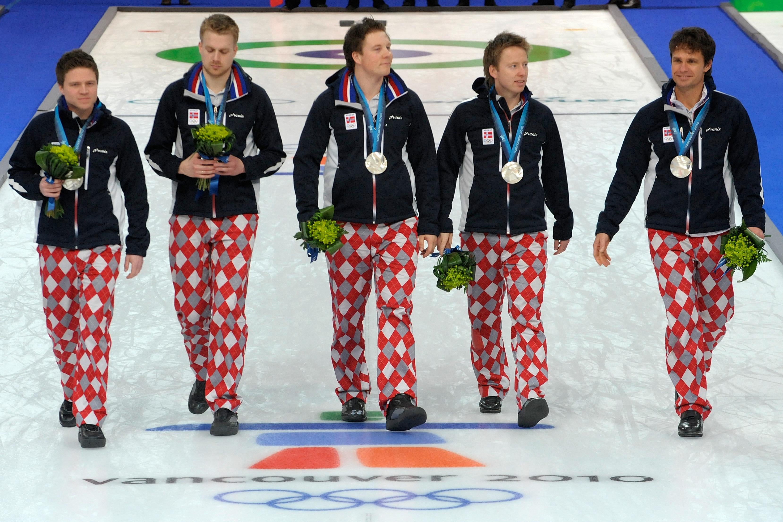 Silver medal winner Norway team, (L-R) Thomas Loevold, Haavard Vad Petersson, Christoffer Svae, Torger Nergaard and Thomas Ulsrud march on the sheet during the medal presentation ceremony after their Vancouver Winter Olympics men's curling gold medal match at the Vancouver Olympic Centre, on February 27, 2010.    AFP PHOTO / TOSHIFUMI KITAMURA (Photo credit should read TOSHIFUMI KITAMURA/AFP/Getty Images)