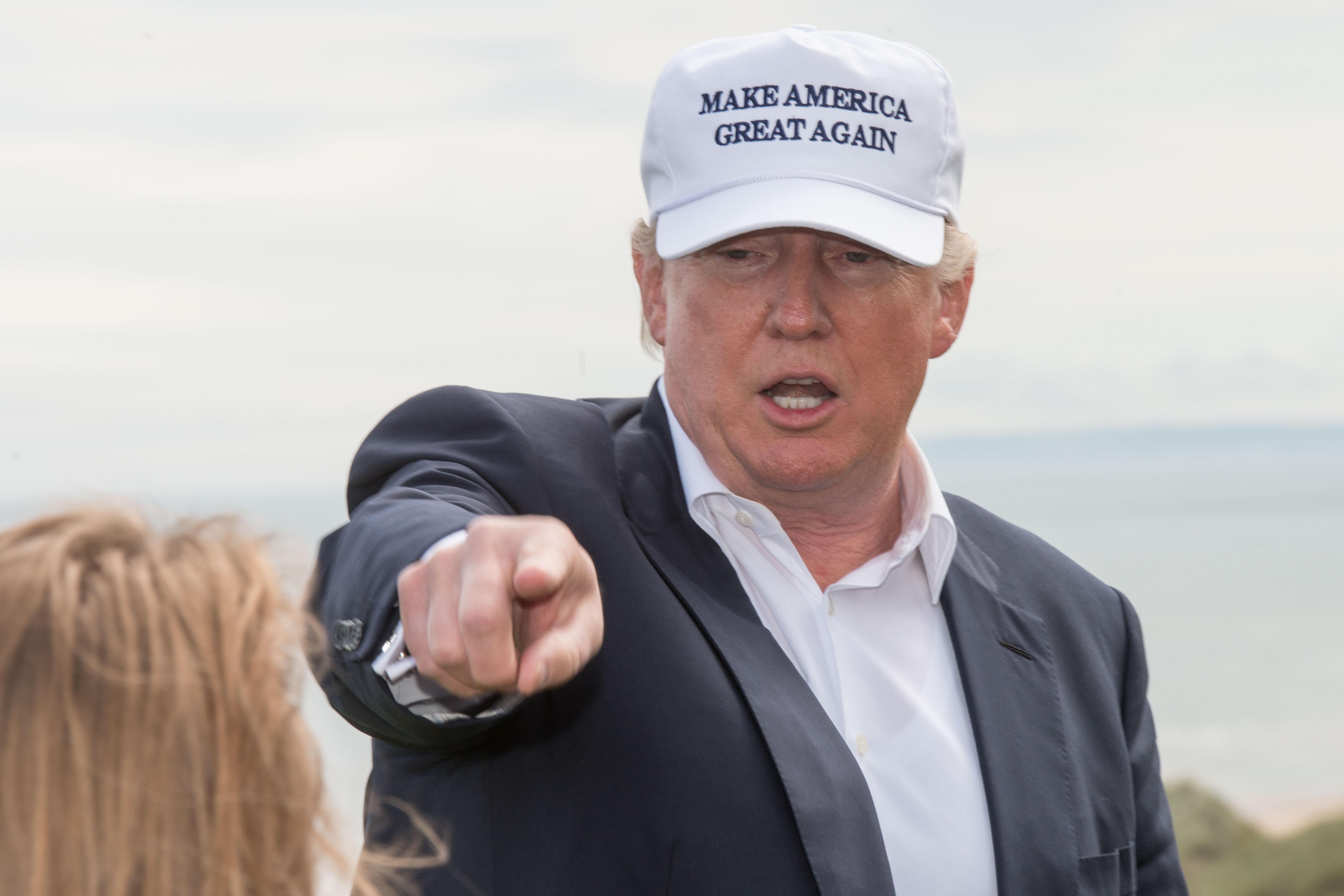 Donald Trump speaks to members of the media during a tour of his International Golf Links course north of Aberdeen on the east coast of Scotland on June 25, 2016. 