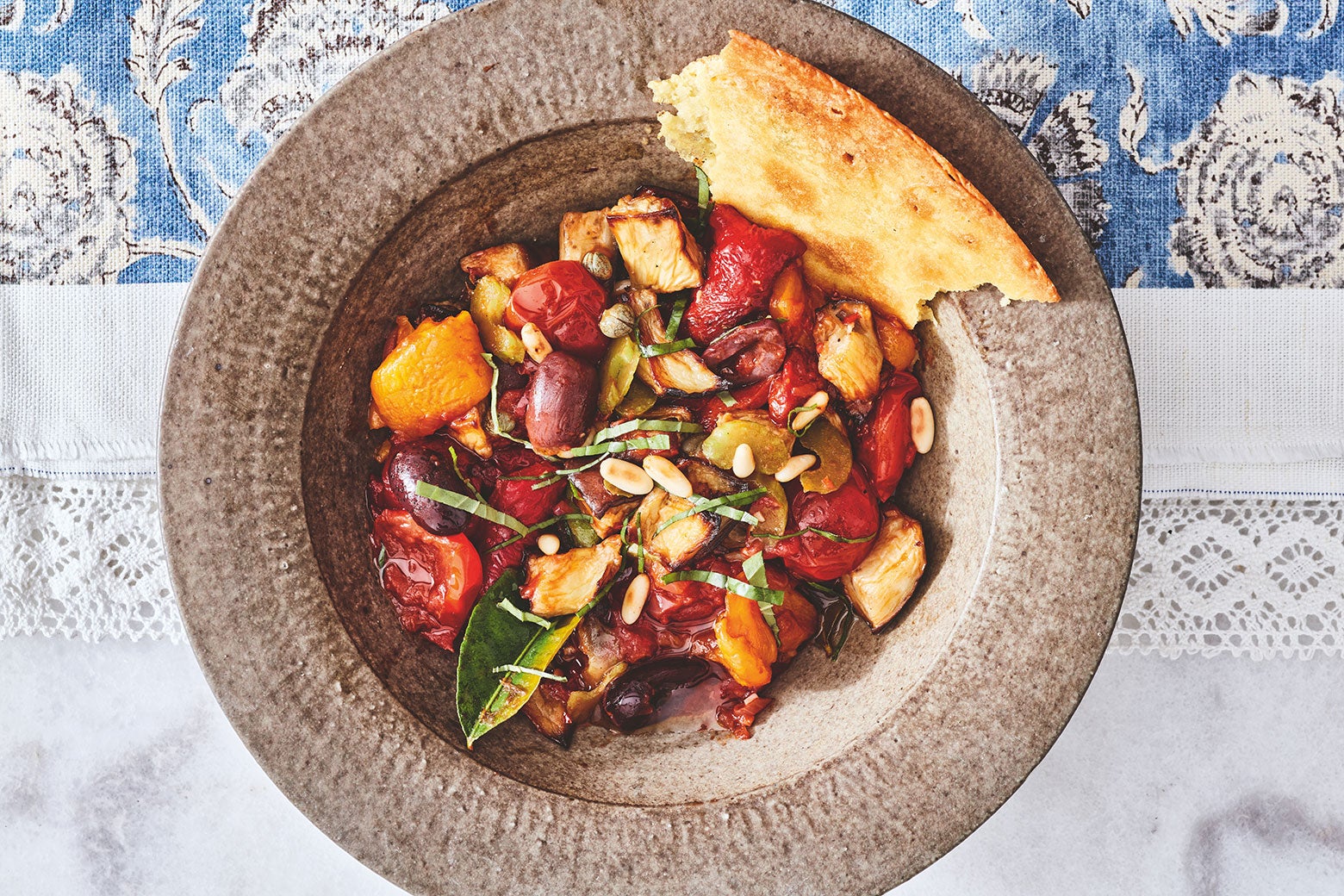 recipes A summery tomato-and-herb dish served with flatbread.