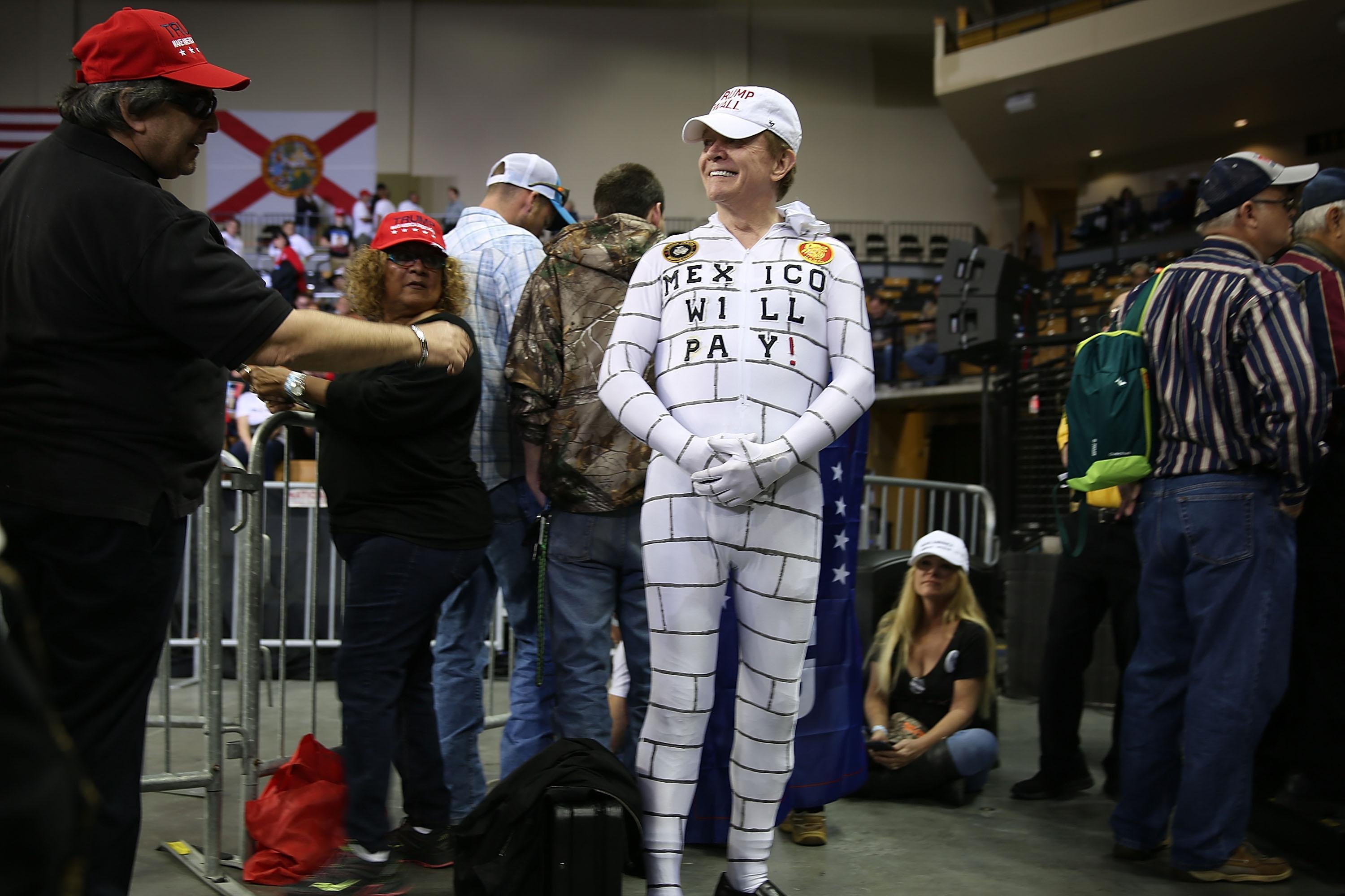 Steve Travers dressed as a wall waits for the arrival of Donald Trump to speak at the CFE Arena during a campaign stop on the campus of the University of Central Florida on March 5, 2016 in Orlando, Florida.