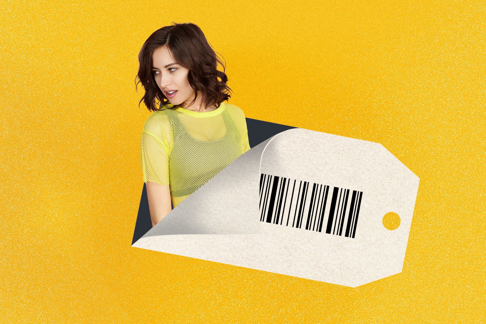 A woman wearing a sheer yellow top with black bra visible underneath emerges from a bar code sticker.