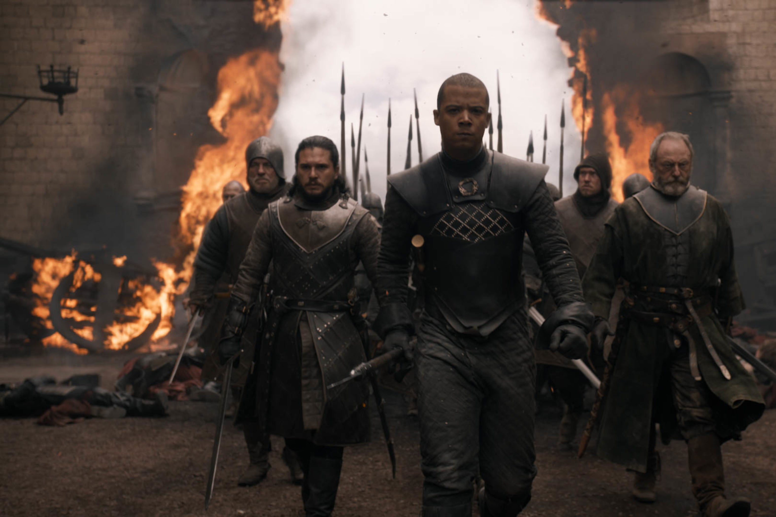 Jon Snow and friends striding through a burnt-down wall.
