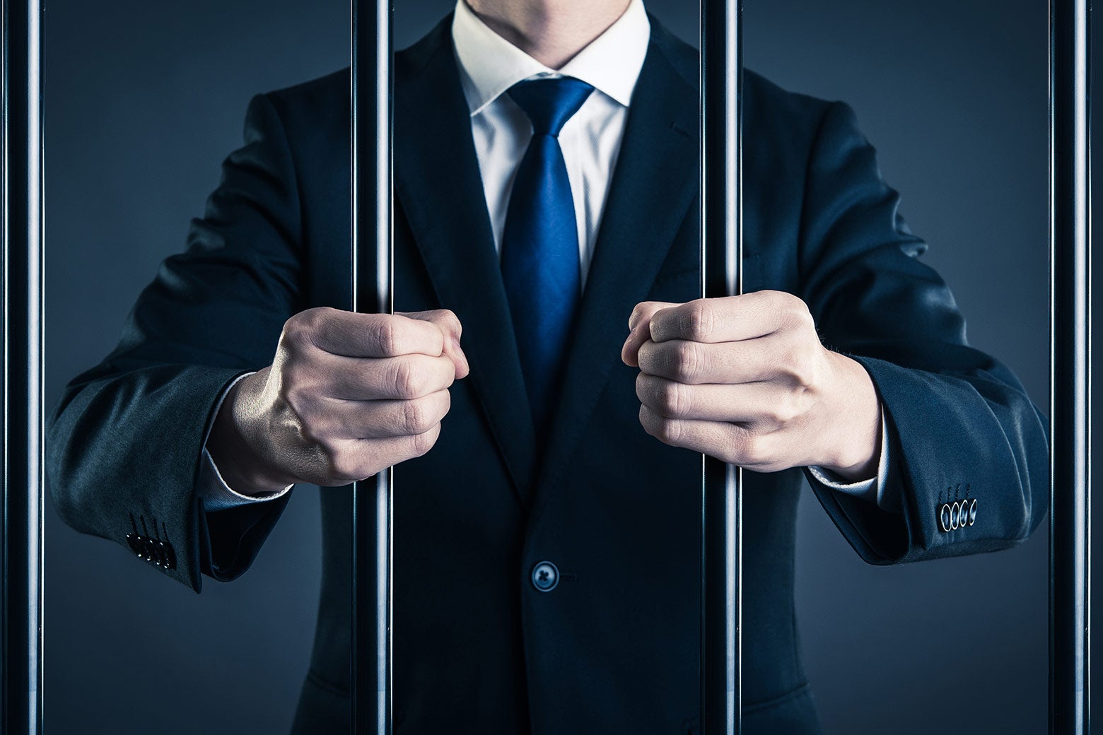 Suited executive behind bars