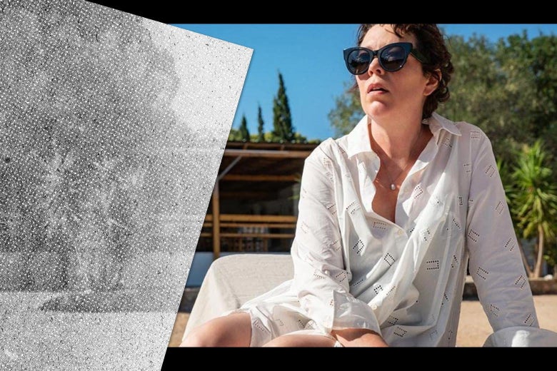 Olivia Colman, wearing a white beach coverup and sunglasses, lounges on a beach.