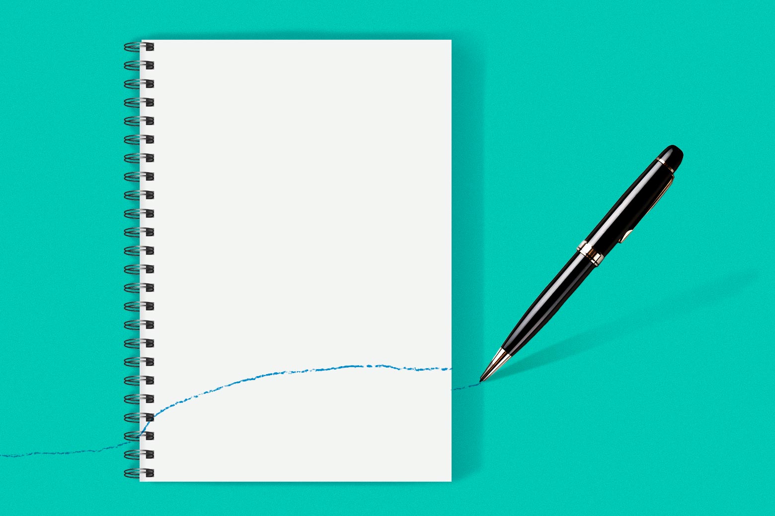 A notepad with a pen next to it that's already drawn a single line across the blank page