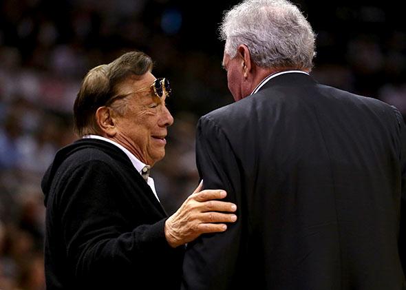 Team owner Donald Sterling of Los Angeles Clippers talks with team owner Peter Holt of the San Antonio Spurs.
