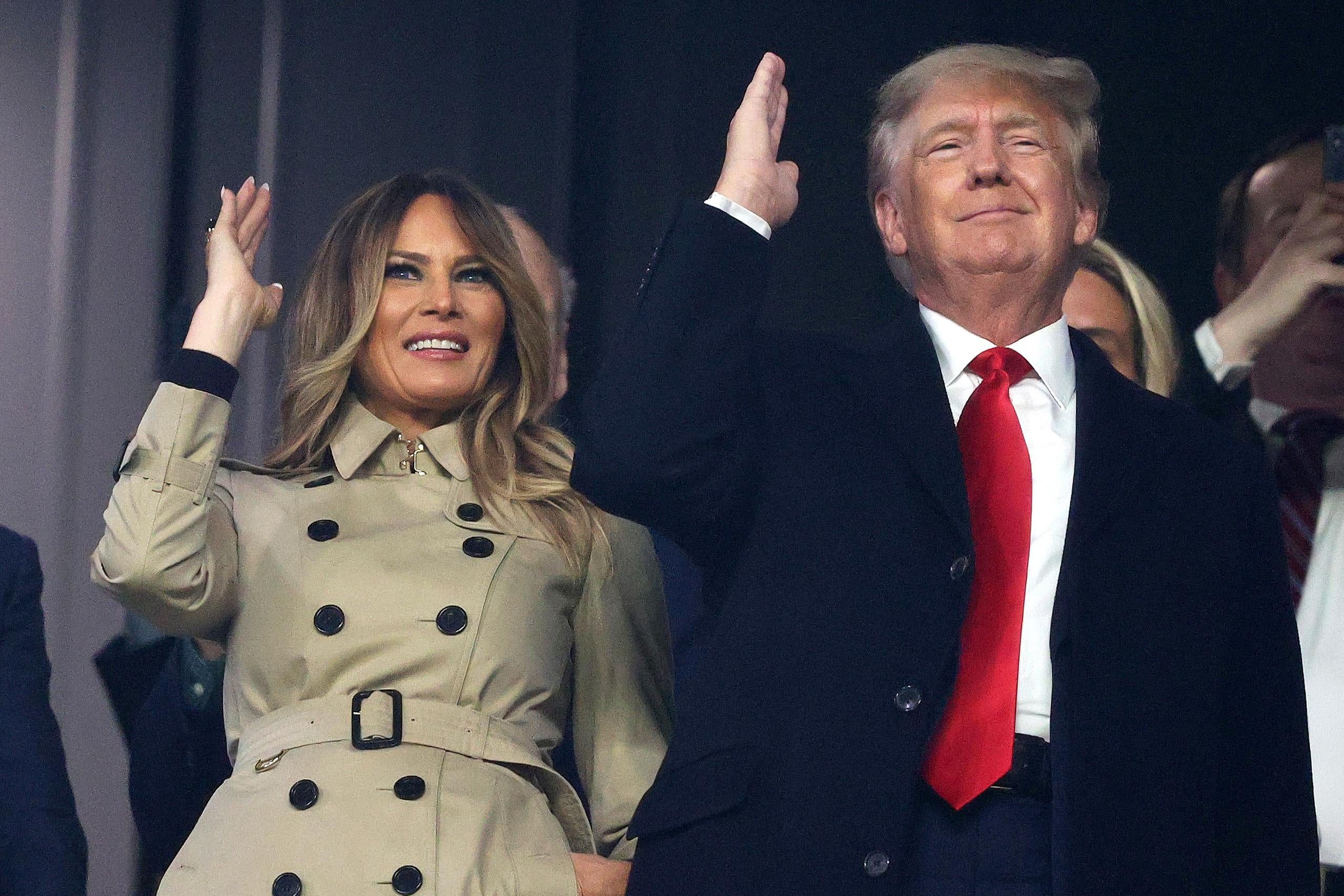 Former first lady and president of the United States Melania and Donald Trump do "the chop" prior to Game Four of the World Series between the Houston Astros and the Atlanta Braves Truist Park on October 30, 2021 in Atlanta, Georgia. 