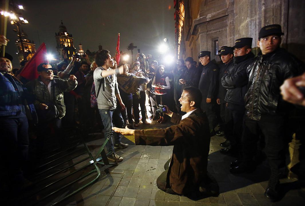 protesters outside the palace in the historic center of Mexico City.