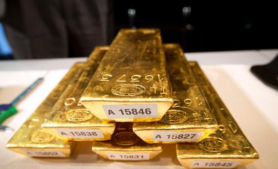 Bars of gold are piled up during a press conference at the German Federal Bank in Frankfurt am Main, Western Germany, on Jan. 16, 2013