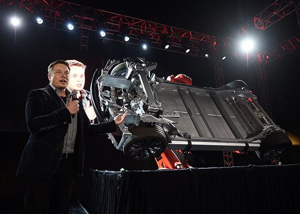 Tesla founder and chief executive Elon Musk unveils the new Tesla 'D' model in Los Angeles on October 9, 2014. 