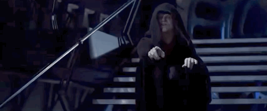 Emperor Palpatine shoots lightning bolts out of his hands at a grimacing Luke.