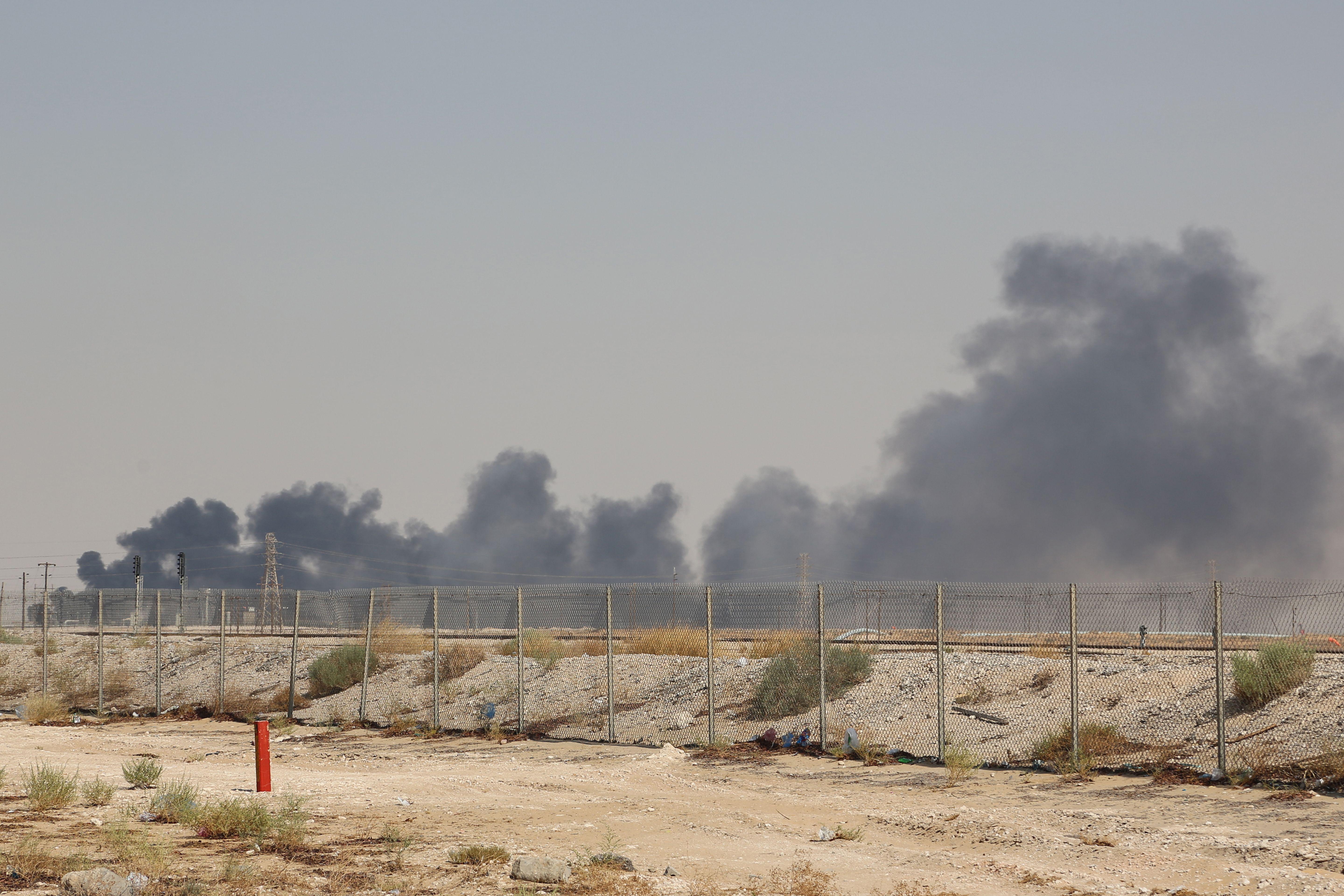 Smoke billows from an Aramco oil facility in Abqaiq about 37 miles southwest of Dhahran in Saudi Arabia's eastern province on September 14, 2019. 