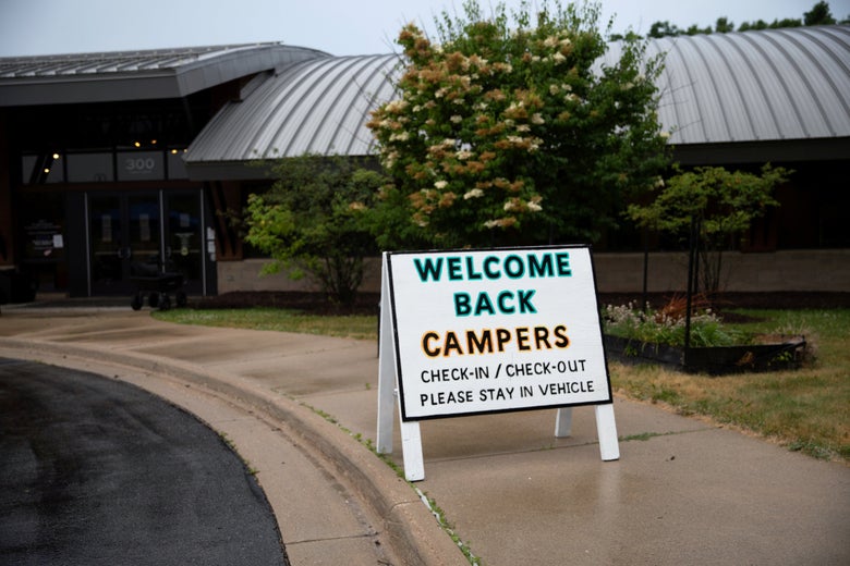 Children arrive for check-in amid the coronavirus pandemic at Carls Family YMCA summer camp in Milford, Michigan on June 23, 2020.
