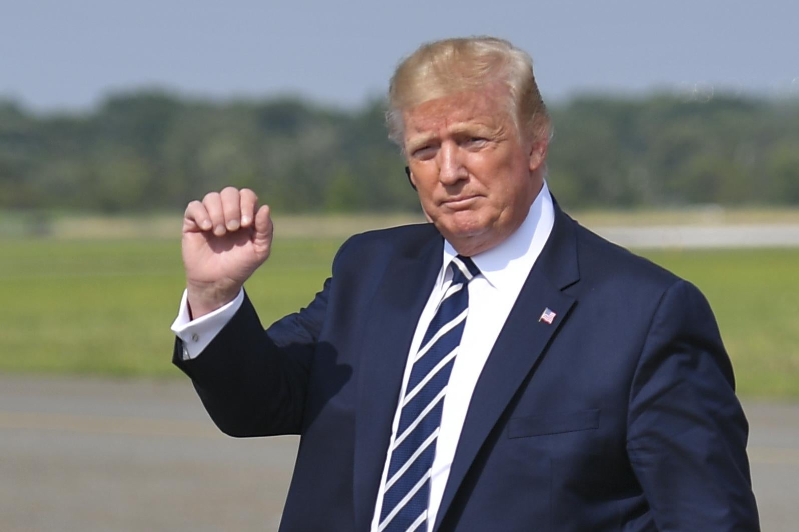 President Donald Trump steps off Air Force One upon arrival at Morristown Municipal Airport in Morristown, New Jersey en route Bedminster, New Jersey on July 19, 2019.