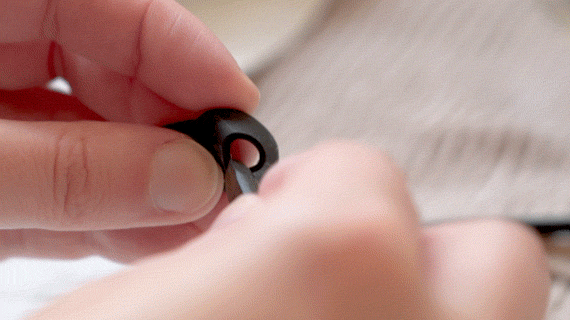 someone cleaning the inside of their headphone