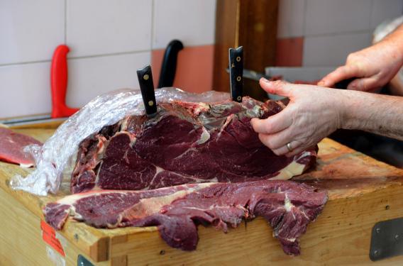 An artisan butcher cuts a piece of horsemeat in a traditional horse butchery in southern France. Not everyone who eats horse does so by choice, however.