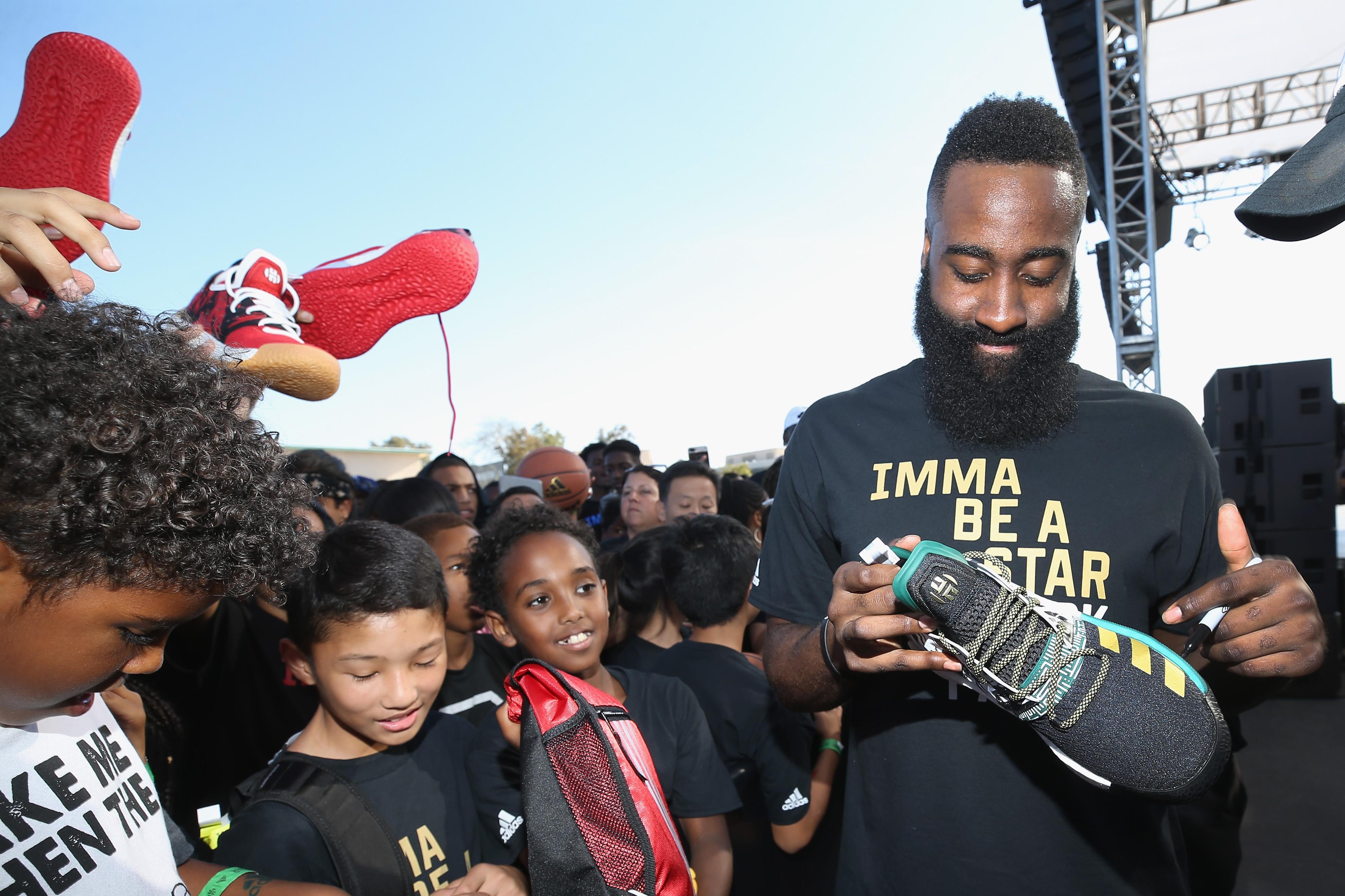 LOS ANGELES, CA - JUNE 24:  James Harden signs autographs at 'Imma Be a Star' Block Party at Audubon Middle School on June 24, 2018 in Los Angeles, California.  (Photo by Phillip Faraone/Getty Images for adidas)