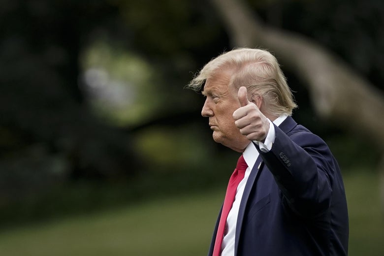 President Donald Trump gives a thumbs-up.