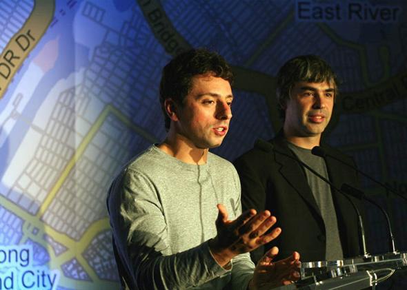 Google founders Larry Page (R) and Sergey Brin (L) speak at a press conference announcing Google's launch of a new transit mapping feature of Google Maps.