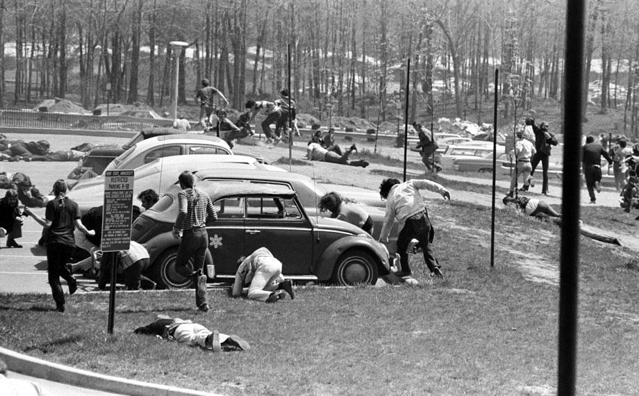 Students dive to the ground as the Guard fires on faculty and students, May 4, 1970.