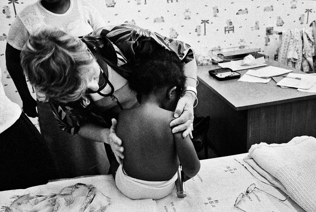 November 2002  / Johannesburg, GautengProfessor Lorna Jacklin, a neuro-developmental pediatrician and director of the Teddy Bear Clinic for Abused Children, begins a forensic medical examination on a sexually abused two-and-a-half-year-old girl. Asked to lie down for the  medical check up, the toddler lay back and spread her legs as she had been taught to do by the perpetrator.