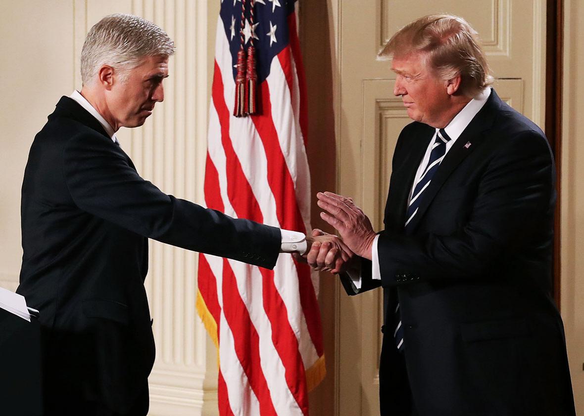 U.S. President Donald Trump shakes hands with Judge Neil Gorsuch after nominating him to the Supreme Court during a ceremony in the East Room of the White House January 31, 2017 in Washington, DC. 
