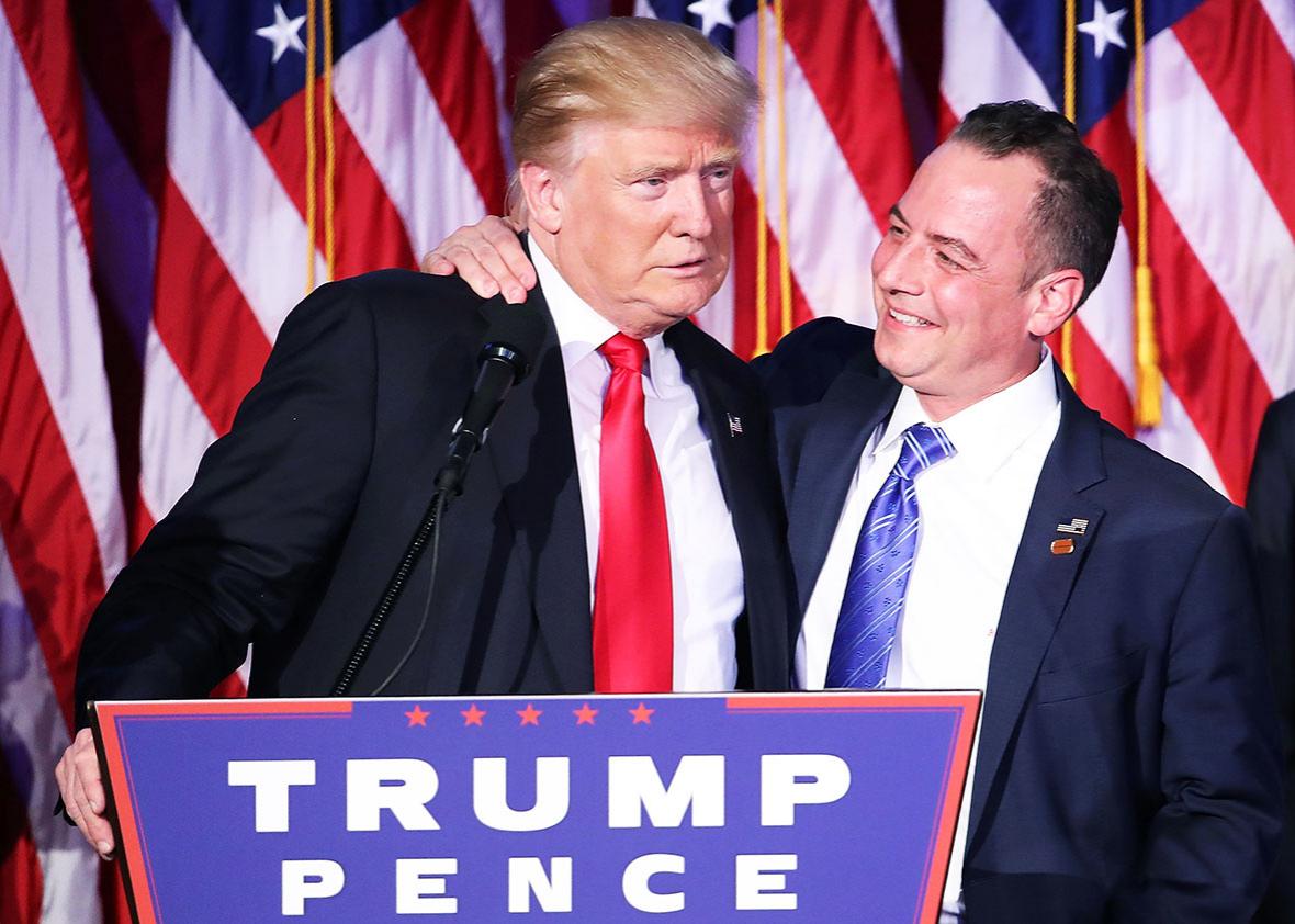 Republican president-elect Donald Trump and Reince Priebus, chairman of the Republican National Committee, embrace during his election night event at the New York Hilton Midtown in the early morning hours of November 9, 2016 in New York City. 