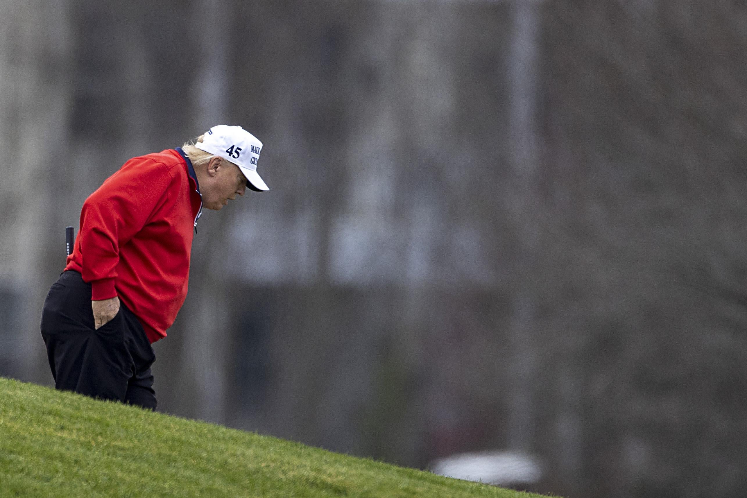 President Donald Trump golfs at Trump National Golf Club on November 21, 2020in Sterling, Virginia.