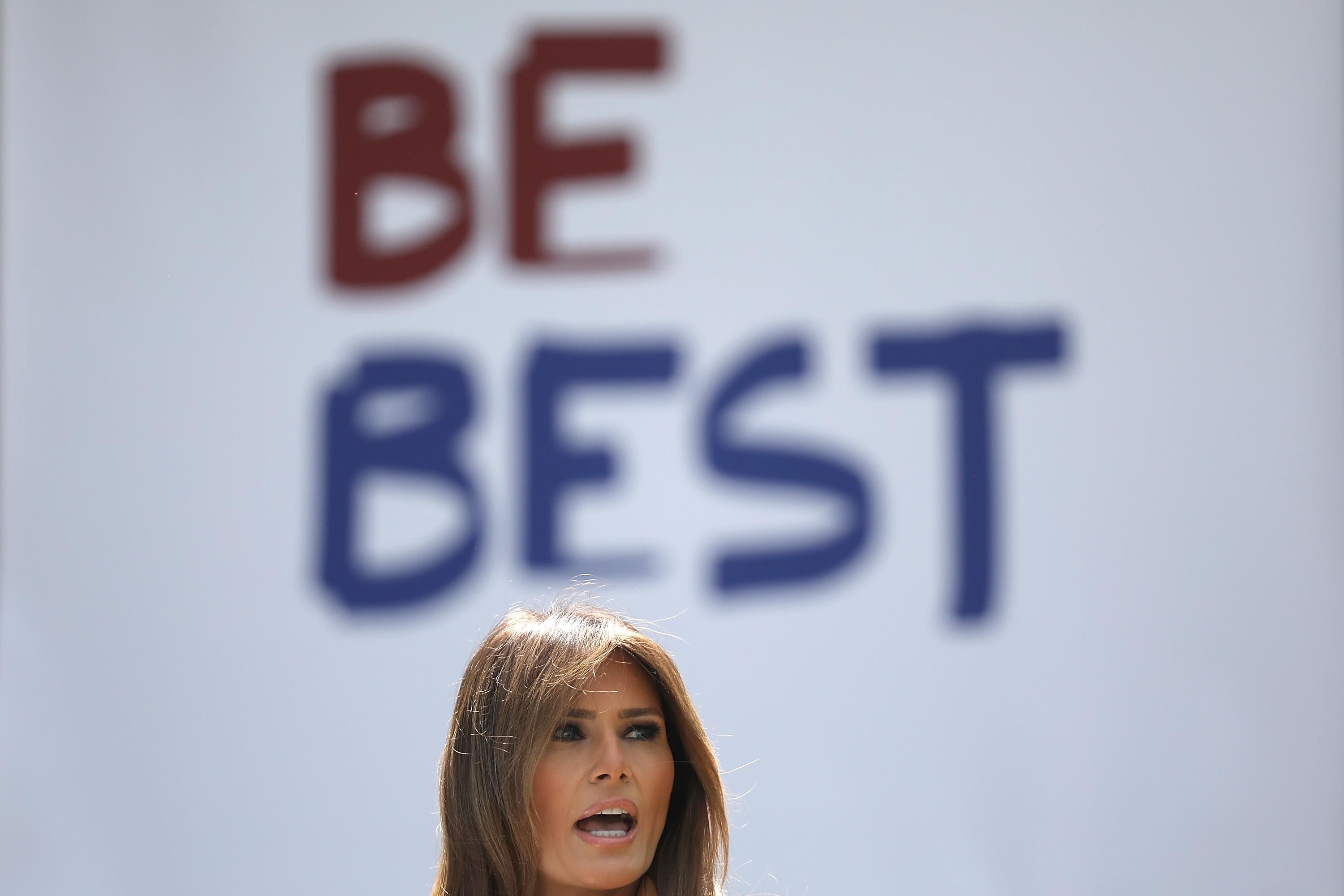 A "Be Best" poster is seen behind Melania Trump’s head.